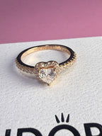 ANILLO BAÑO ROSA CORAZON BLANCO — foto real